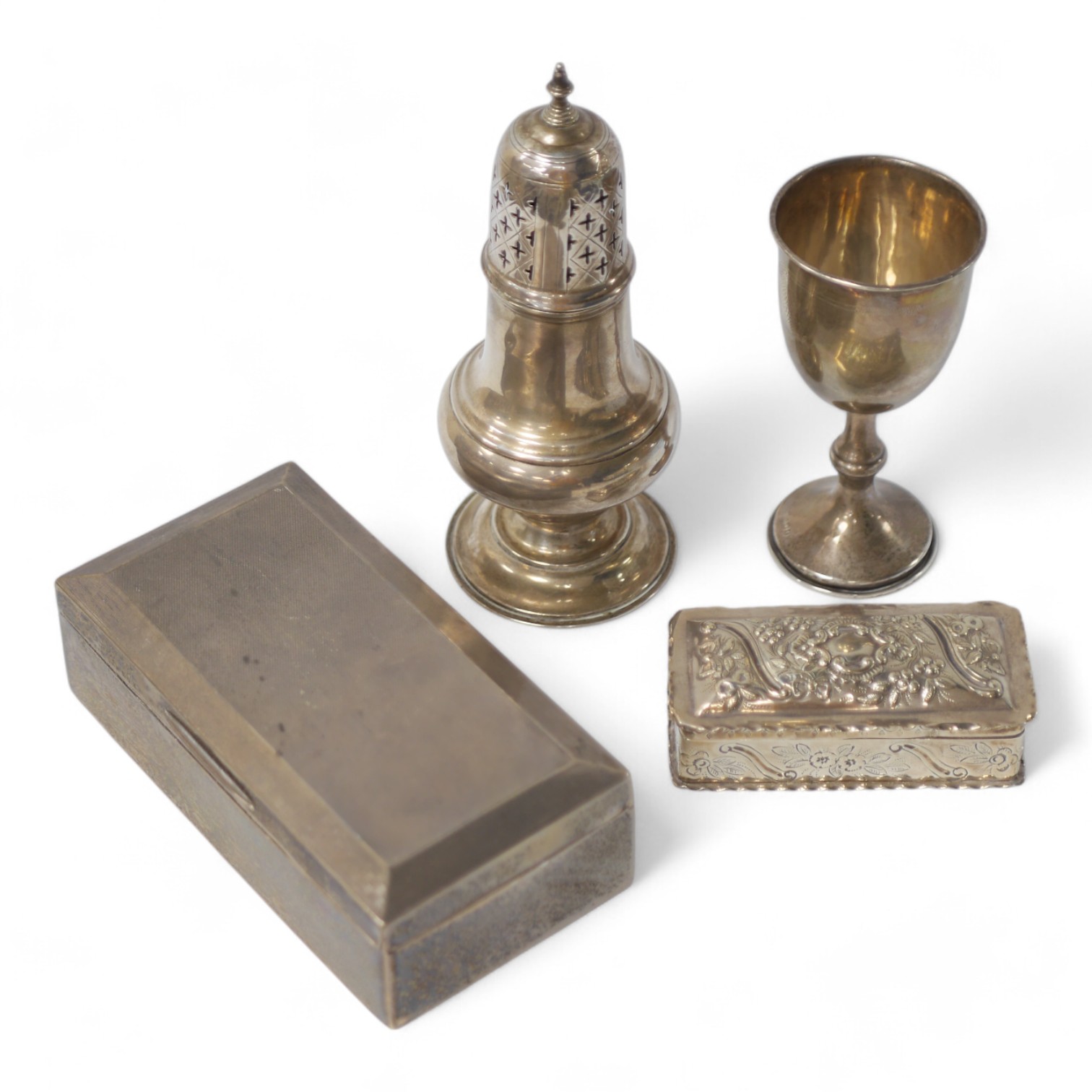 A late Victorian silver sugar caster, Holland, Aldwinckle & Slater, London, 1899, 19.3cm, a silver mounted cigarette box, a late Victorian repousse silver trinket box and cover by William Comyns and a George V silver gob